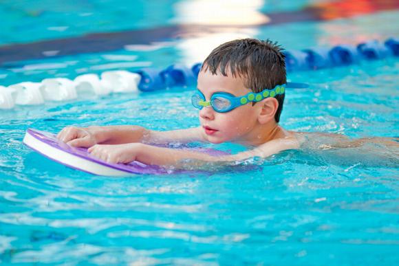 boy swimming in pool