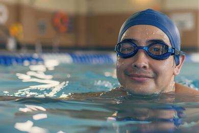 man swimming in pool